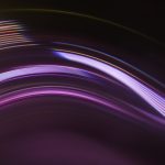 Full frame abstract image of purple light trails against black background