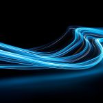 Abstract Blue Neon Light Streaks on Black Background